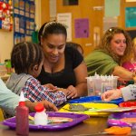 young students in preschool with their teachers